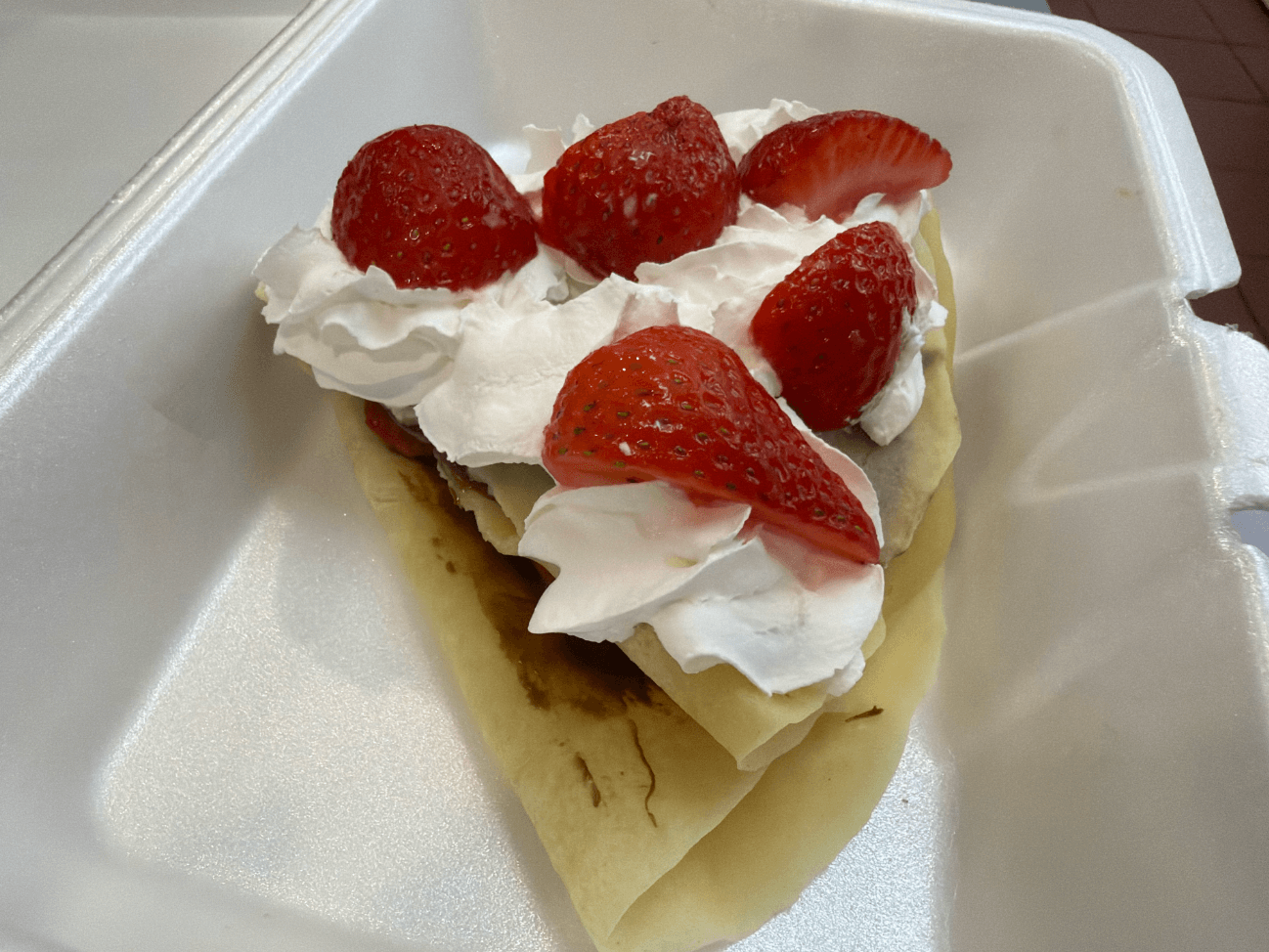 Warm crepe filled with ice cream, fruit, chocolate, and whipped cream at La Michoacana Tradicional in Pomona, CA